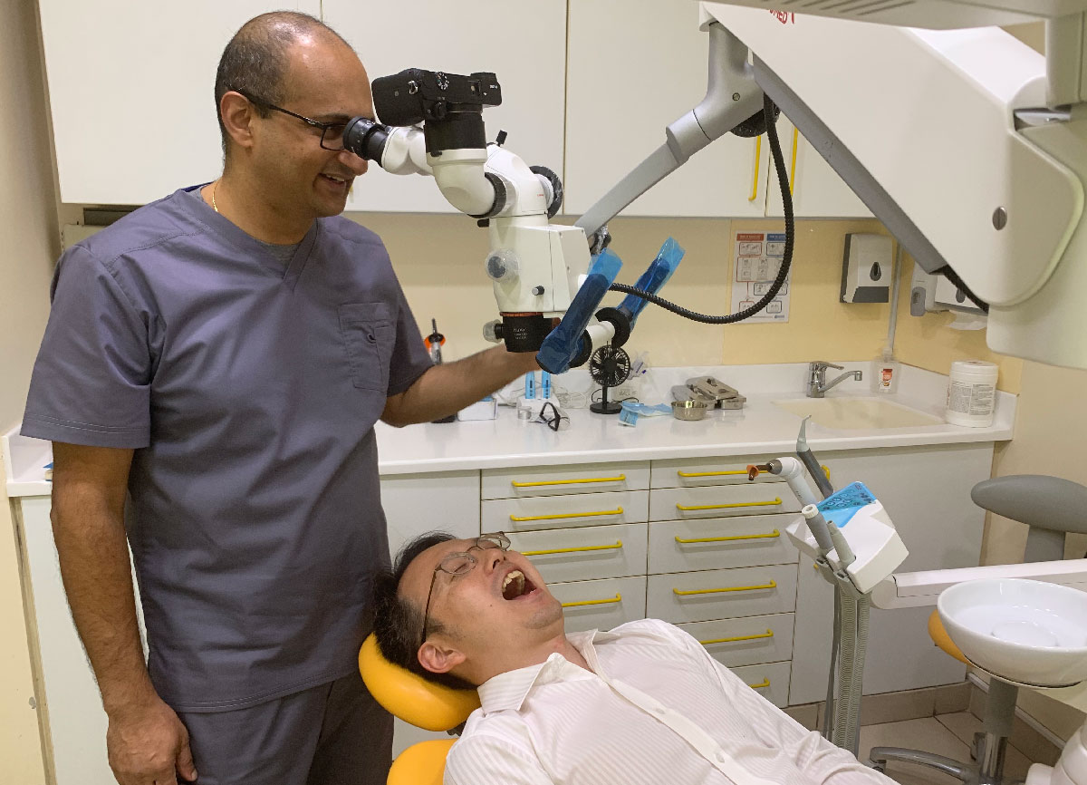 Dr Madhu with microscope